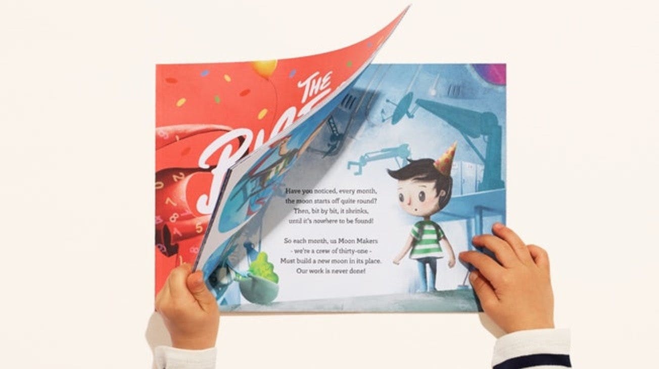 An image of the boy opening the birthday thief book